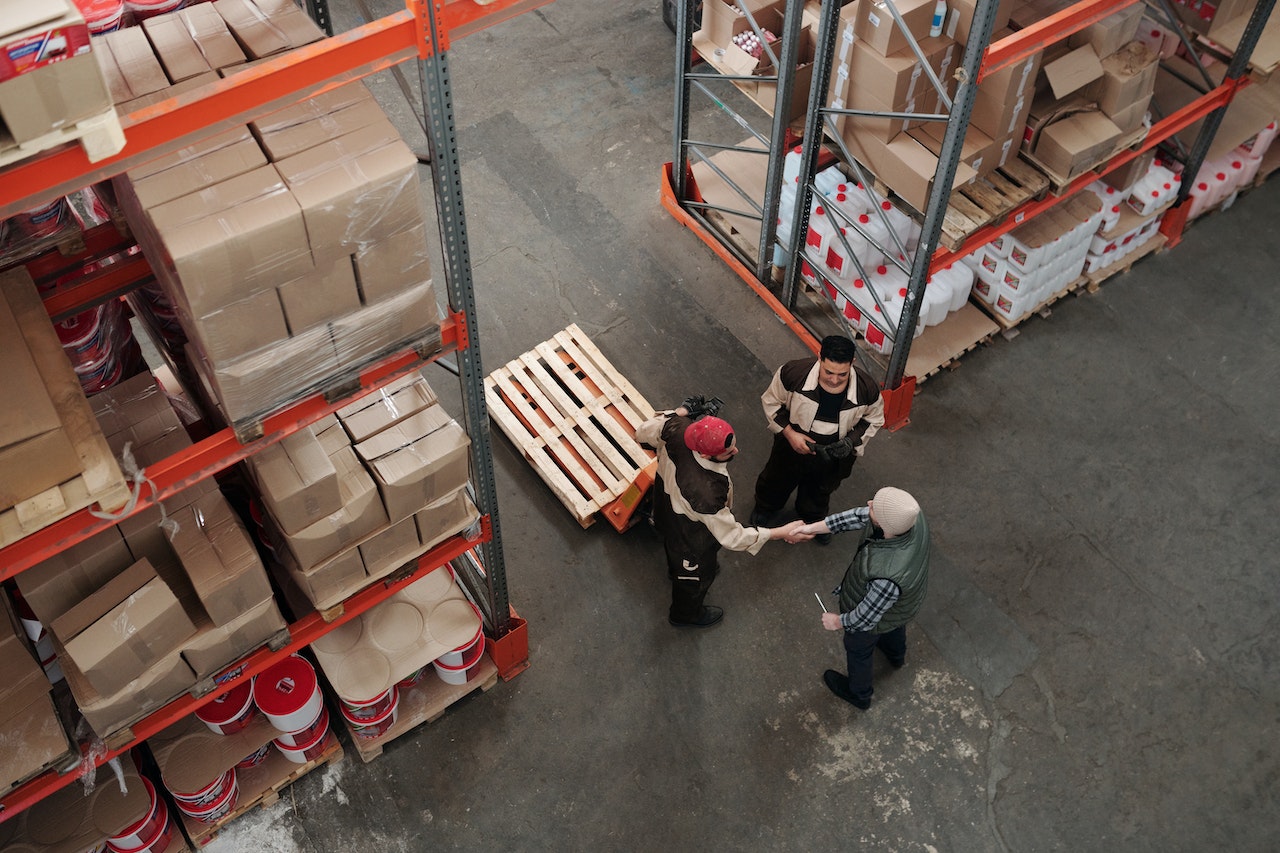 men working in warehouse image