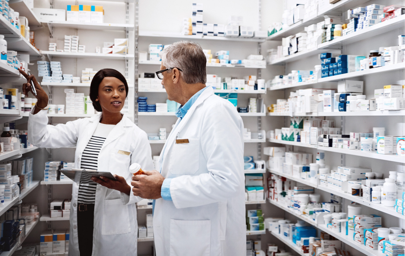 Pharmacists talking about standardizing their workflows. 