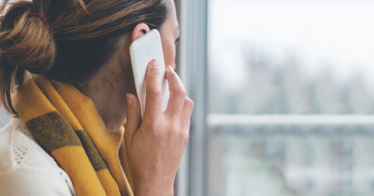 woman speaking on smartphone