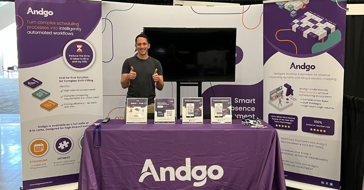 andgo team member ryan standing at the andgo booth at an event