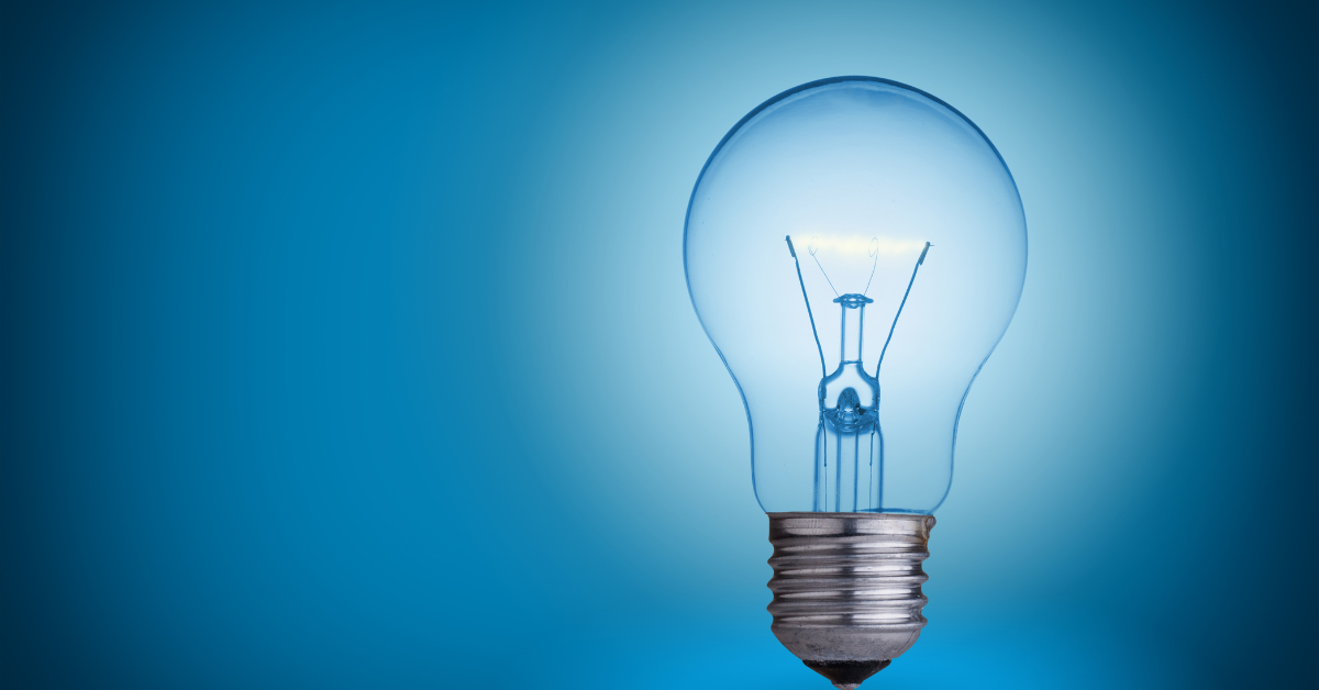 light bulb in front of blue background image