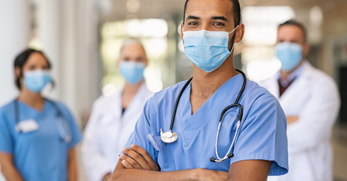 team of doctors and nurses wearing masks image